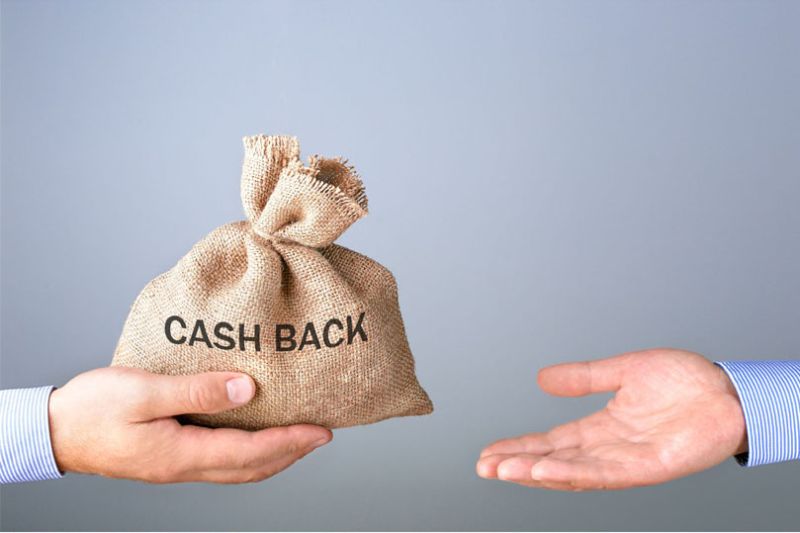 Exchange of sack of money between two hands. Cash Back written on the sack.